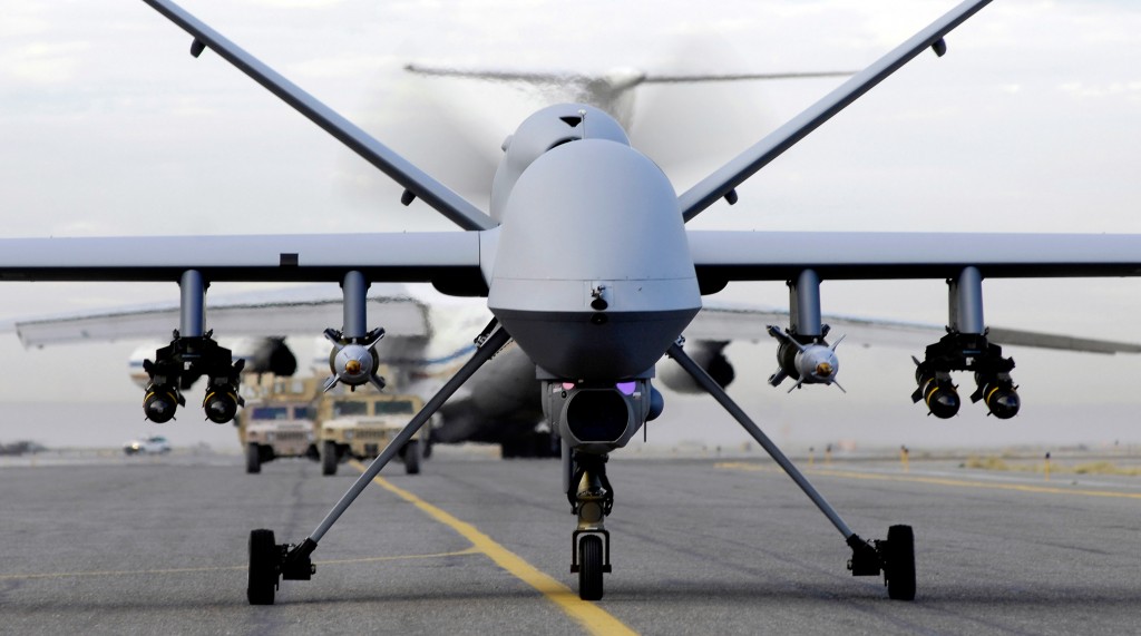 An MQ-9 Reaper loaded with missiles moves down the runway at an Afghanistan base; US National Guard photo